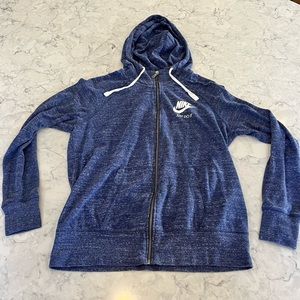 Super soft Nike hoodie with full zipper and logo on the chest. Size Large.